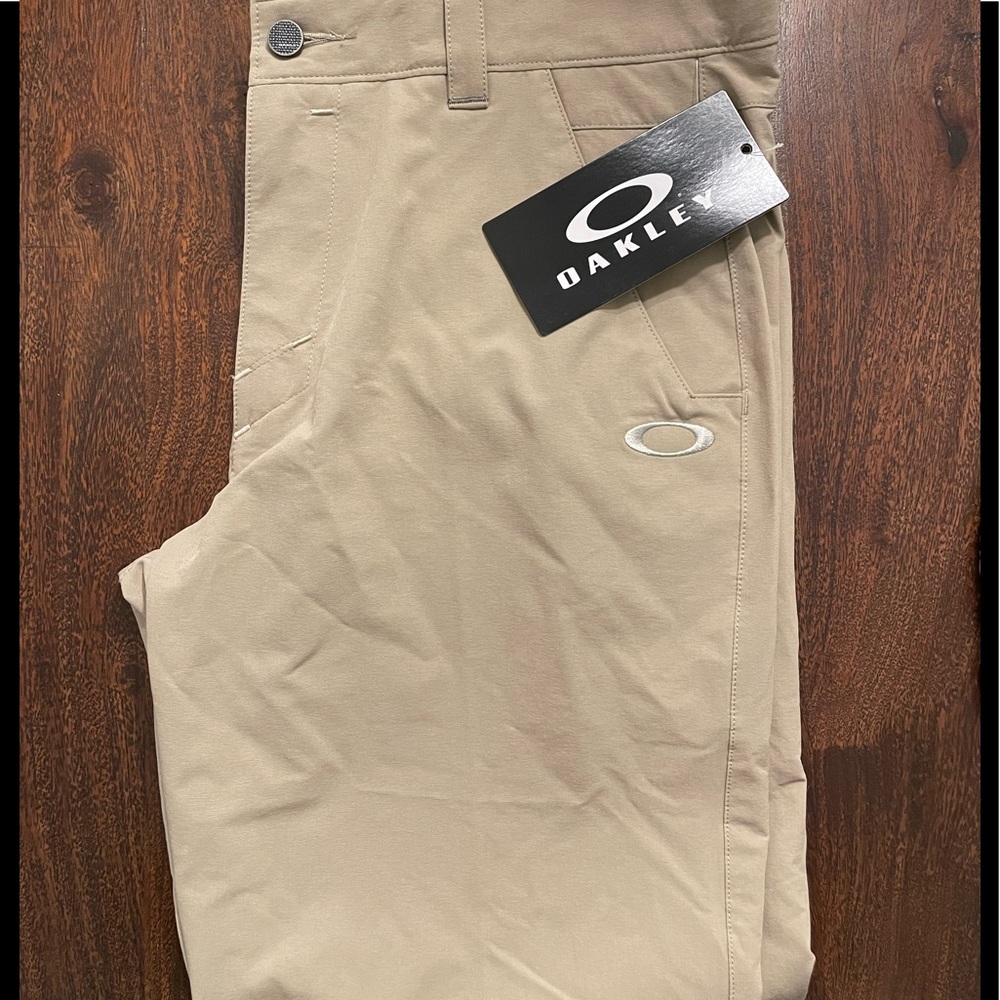 Oakley Mens Khaki Athletic Pants. Silver embroidery.